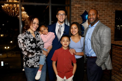 TC Bell with his family at an evening event