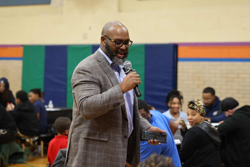 TC Bell engaging the room from the floor