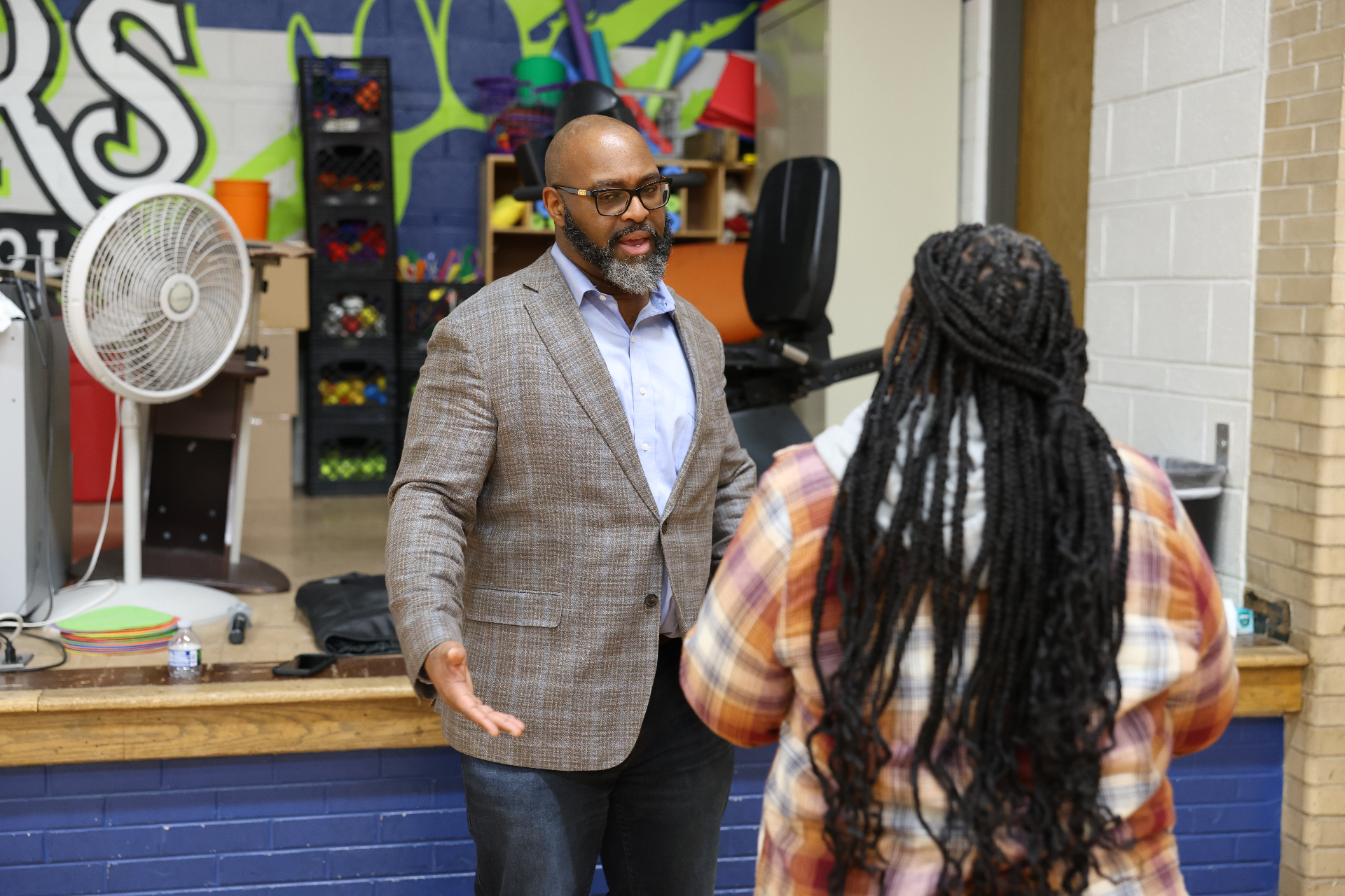 TC Bell in conversation with an attendee after a session