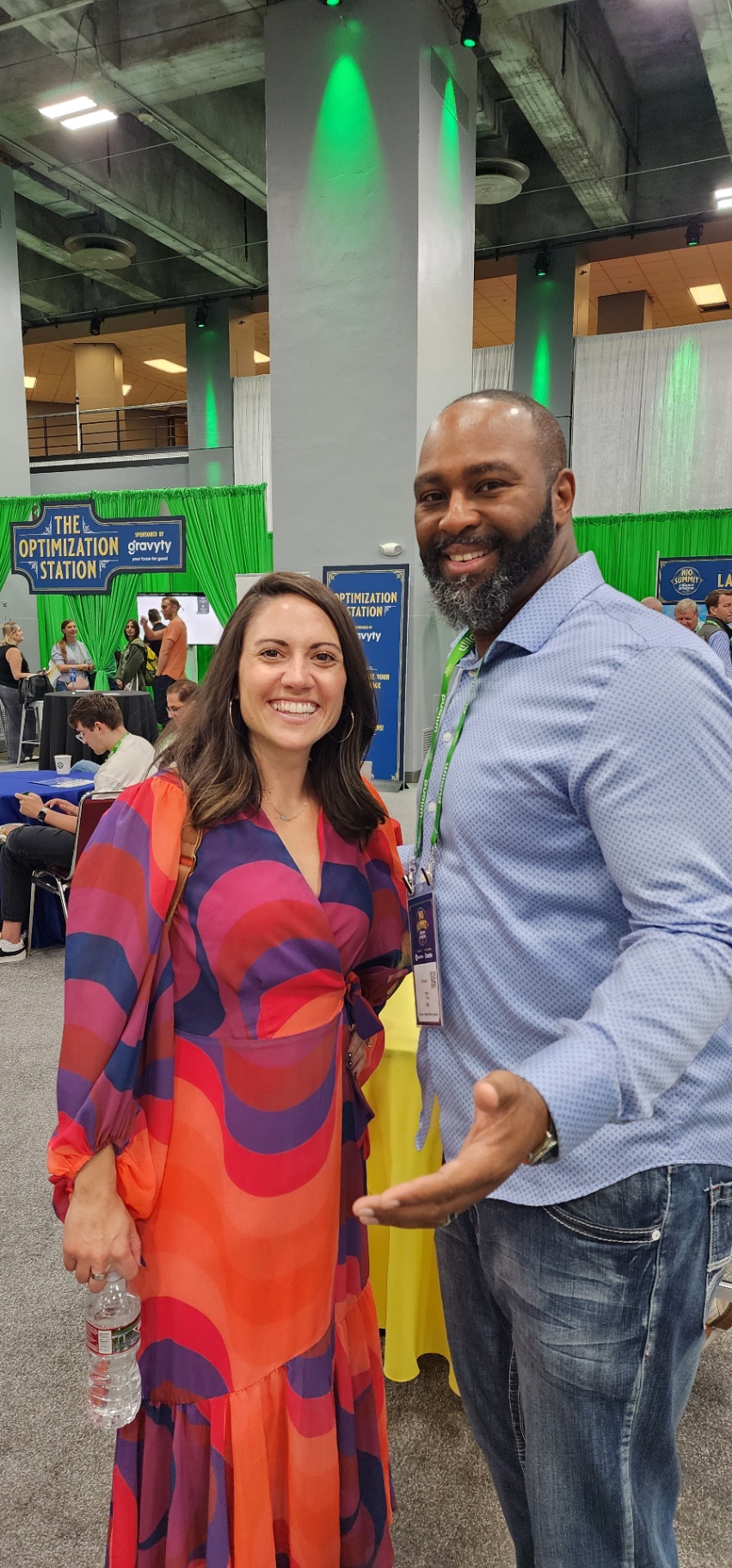 TC Bell at a professional event with a fellow attendee
